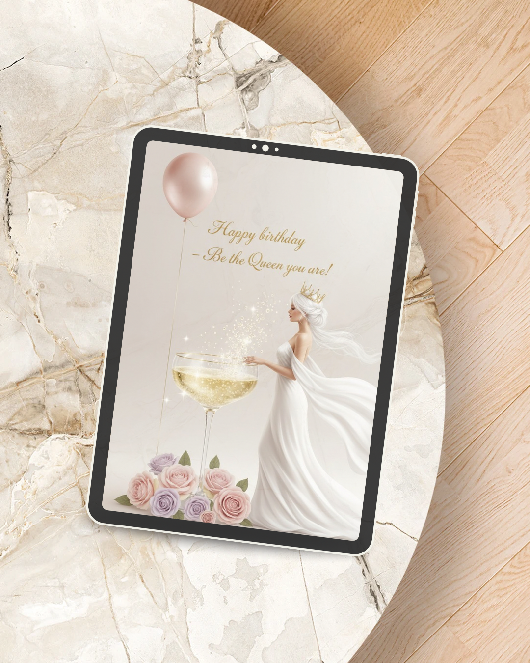 Digital birthday card displayed on iPad showing Happy Birthday Queen design