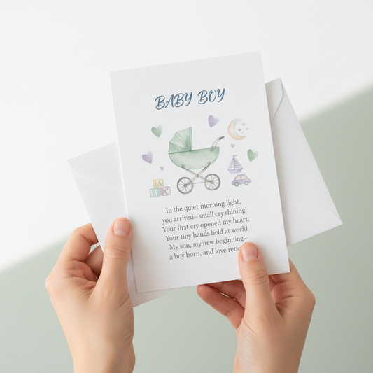 Hands holding baby boy birth announcement card in pastel blue